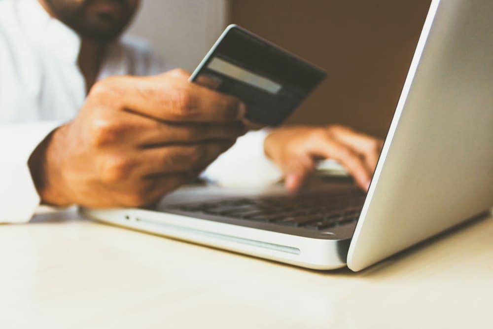 Open banking payment card and laptop